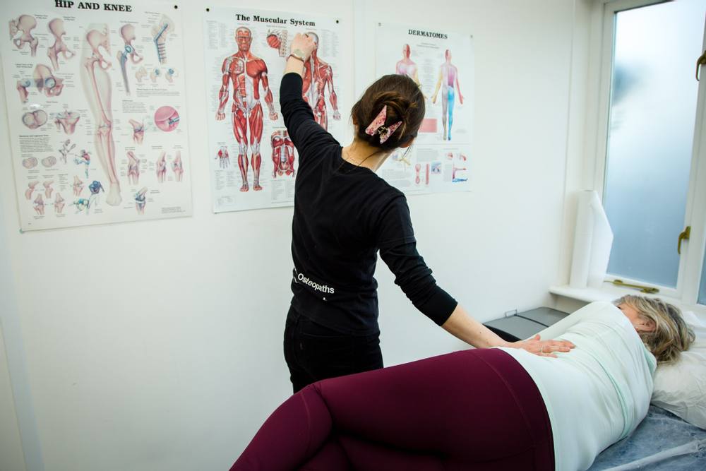 Emily showing a patient a chart