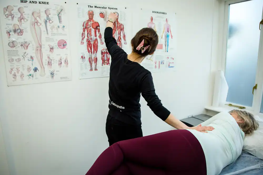 Emily showing a patient a chart
